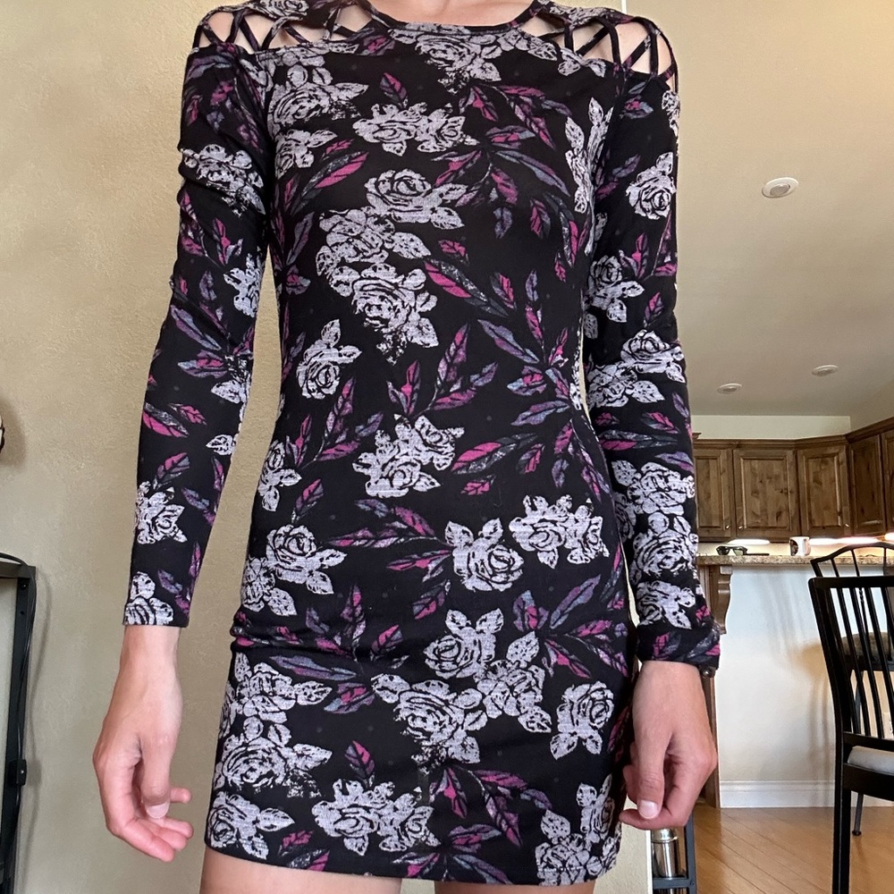 Free people mini dress black with floral print. Size medium.